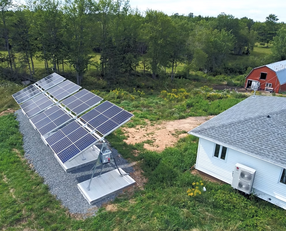 Licensed solar installation crew completing a residential PV system mounting in rural Nova Scotia